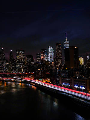 A City Skyline At Night Wallpaper