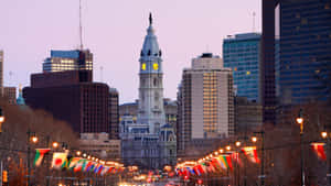 A City Street With A Clock Tower Wallpaper