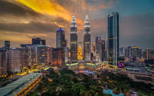 A Cityscape With The Petronas Towers In The Background Wallpaper