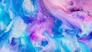 A Close Up Of A Blue And Purple Paint Wallpaper