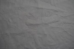 A Close Up Of A Grey Fabric Wallpaper