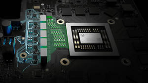 A Close Up Of A Motherboard With A Green Chip Wallpaper