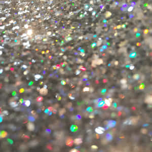 A Close Up Of A Silver Glitter Surface Wallpaper