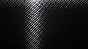 A Close-up View Of Black Carbon Fiber In A Luxurious Pattern Wallpaper