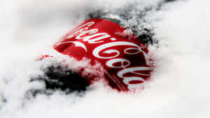 A Coca Cola Bottle Covered In Snow Wallpaper