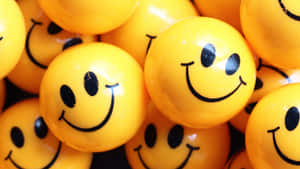 A Collection Of Cute Smile Emoji Balls Expressing Different Emotions. Wallpaper