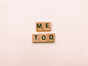 A Collection Of Scrabble Tiles Spread Out As A Text Background. Wallpaper