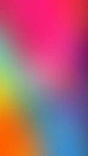 A Colorful Blurred Background With A Rainbow Of Colors Wallpaper