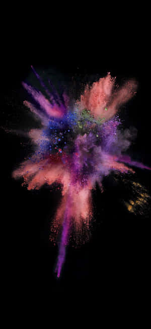 A Colorful Powder Explosion On A Black Background Wallpaper