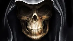 A Creepy Halloween Skeleton Emerging From The Shadows Wallpaper