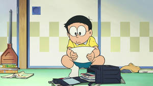 A Cute Nobita Reading Wallpaper