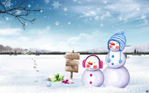 A Cute Snowman Smiling On A Winter Day Wallpaper