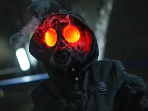 A Dark Anime Boy With A Mysterious Smirk Wallpaper