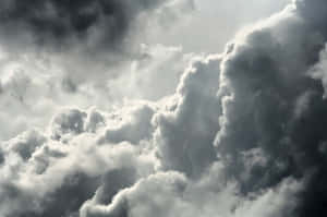 A Dark Sky With Many Clouds Wallpaper
