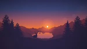 A Deer Silhouetted Against The Sunset In The Mountains Wallpaper