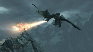 A Dragon Flying Over A Mountain With Flames Wallpaper