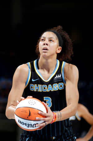 A Female Basketball Player Holding A Ball Wallpaper