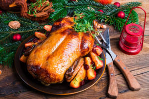 A Festive Christmas Dinner Featuring Roasted Turkey Wallpaper