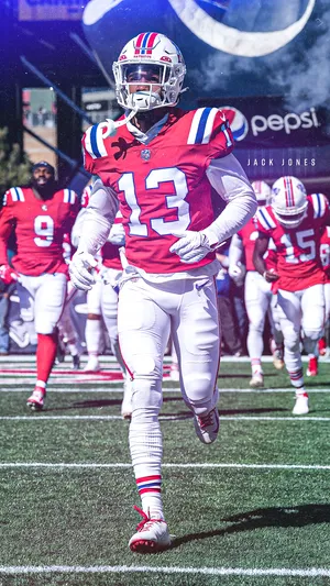 A Football Player Running Wallpaper