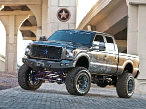 A Ford Super Duty Truck Is Parked On A Street Wallpaper