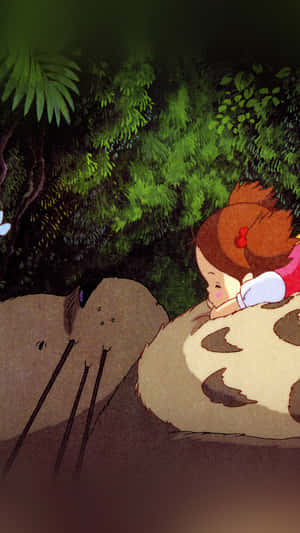 A Girl Is Laying On A Giant Totoro Wallpaper