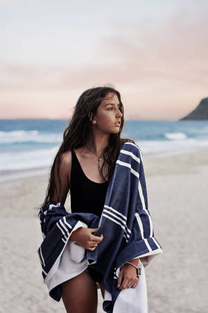 A Girl On The Beach Enjoying The Sun Wallpaper