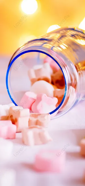 A Glass Bottle With Candy In It Wallpaper