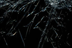 A Glass Window With A Broken Glass Wallpaper