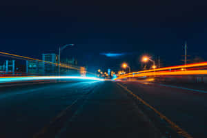 A Glowing Street In The Night Wallpaper