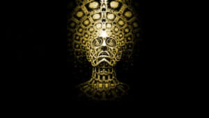A Gold And Black Abstract Image Of A Head Wallpaper