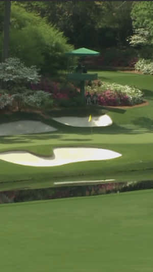 A Golf Course With A Green Tee And A Bunker Wallpaper