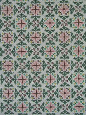 A Green And Pink Tile With Floral Designs Wallpaper