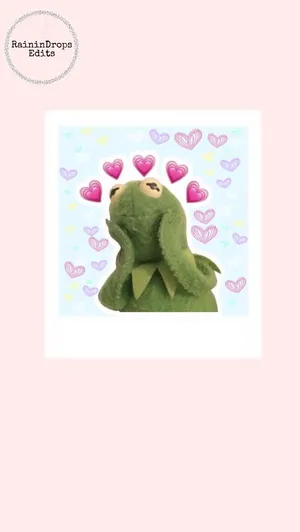 A Green Frog With Hearts On His Face Wallpaper