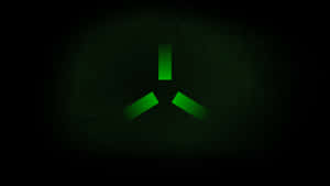 A Green Logo On A Dark Background Wallpaper