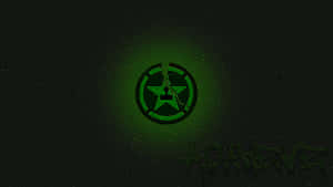 A Green Logo With A Black Background Wallpaper