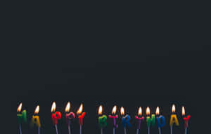 A Group Of Candles With Happy Birthday Written On Them Wallpaper