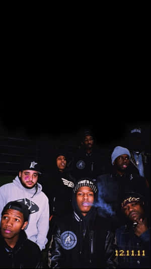 A Group Of Men In Black Hats And Jackets Wallpaper