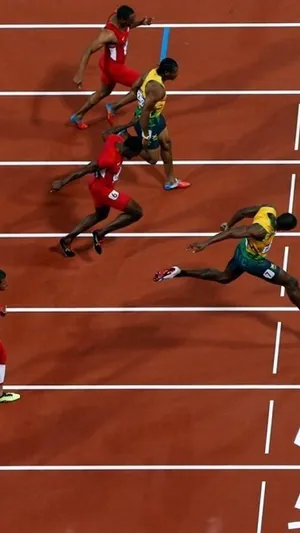 A Group Of Men Running On A Track Wallpaper