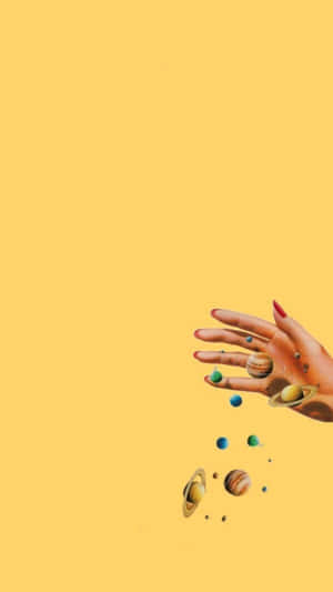 A Hand With Planets In It Wallpaper