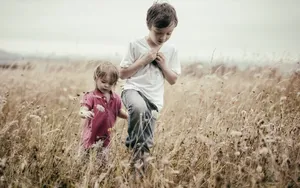 A Heartfelt Moment Between Brother And Sister Wallpaper