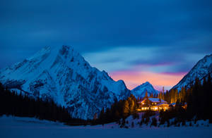 A House In The Mountains At Dusk Wallpaper