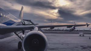 A Jet Airplane On The Tarmac Wallpaper