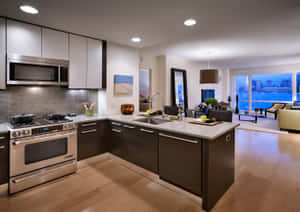 A Kitchen With A Stove And Sink Wallpaper