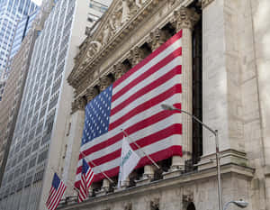 A Large American Flag Is On The Wall Of The New York Stock Exchange Wallpaper