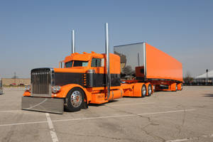 A Large Truck With A Trailer Wallpaper