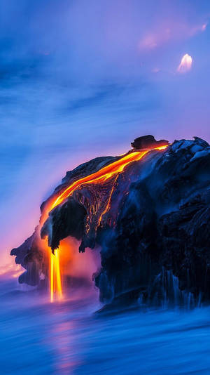 A Lava Flow Is Coming Out Of The Ocean Wallpaper