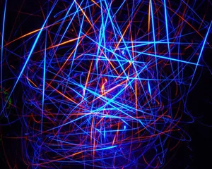 A Light Painting Of Blue And Orange Lines Wallpaper