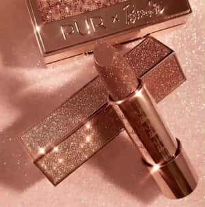A Lipstick With Glitter On Top Of It Wallpaper