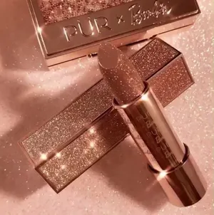A Lipstick With Glitter On Top Of It Wallpaper
