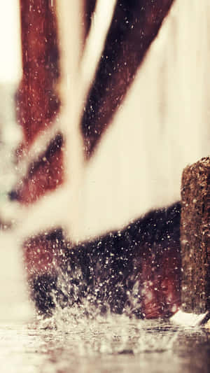 A Liquid Blue Background With A Floating Iphone In The Center Wallpaper